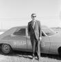Thumbnail image of item number 1 in: '[Budd Kneisel standing in front of WBAP car]'.