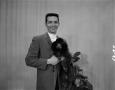 Photograph: [Man with miniature poodle]