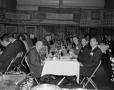 Photograph: [Roy Bacus having a meal with group]