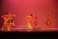 Photograph: [Photograph of dancers performing in long, patterned skirts]