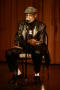 Photograph: [Photograph of Melvin Van Peebles speaking on a stage]