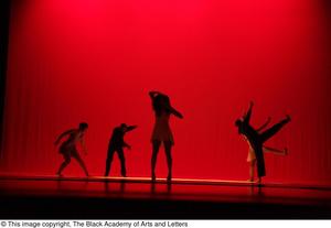 Primary view of object titled '[Photograph of five dancers performing on a stage lit with red lights]'.