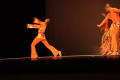 Thumbnail image of item number 1 in: '[Photograph of three dancers standing on stage dressed in orange]'.
