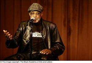 Primary view of object titled '[Photograph of director Melvin Van Peebles on stage]'.