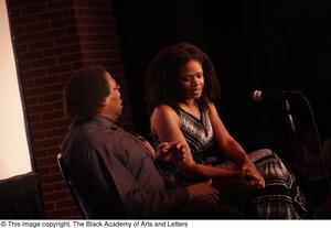 Primary view of object titled '[Kimberly Elise looks toward the ground while talking to Curtis King]'.