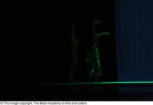 Primary view of object titled '[Photograph of a dancer illuminated by green lights]'.