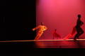 Photograph: [Photograph of three dancers performing with a large strip of red fab…