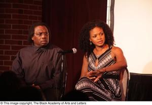 Primary view of object titled '[Kimberly Elise and Curtis King look into the audience]'.