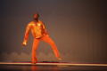 Thumbnail image of item number 1 in: '[Photograph of a man dancing on stage in a gold shirt]'.