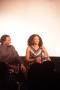 Photograph: [Curtis King laughs as Kimberly Elise looks into crowd]