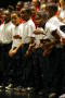 Thumbnail image of item number 1 in: '[Choir members sing while looking at the crowd]'.