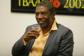 Thumbnail image of item number 1 in: '[Vondie Curtis Hall smiles while holding cup]'.