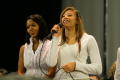Photograph: [Gabby Hill with fellow student performer holding a microphone]