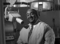 Photograph: [Photograph of Dr. Strotha E. Hardeman, Jr. and his dental equipment …