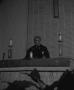 Photograph: [Photograph of Reverend Marshall E. Hodge at altar]