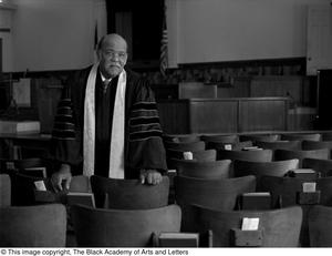 Primary view of object titled '[Reverend J. D. Mooring in Church Sanctuary]'.