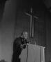 Photograph: [Reverend Marshall E. Hodge standing at podium]