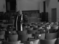 Thumbnail image of item number 1 in: '[Reverend J. D. Mooring standing in Church hall, 2]'.