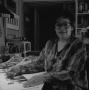 Photograph: [Artist Jean Lacy working in studio #2]