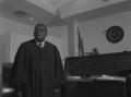 Photograph: [Photograph of L. Clifford Davis standing in courtroom]