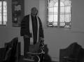 Photograph: [Reverend J. D. Mooring Near Window, 1]