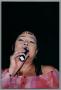 Photograph: [Low-angled close-up of Angela Bofill singing]
