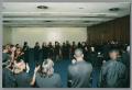 Photograph: [Photograph of the DFW Choir and a crowd of people]