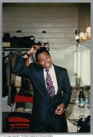 Primary view of object titled '[Photograph of Ernest Thomas in dressing room]'.