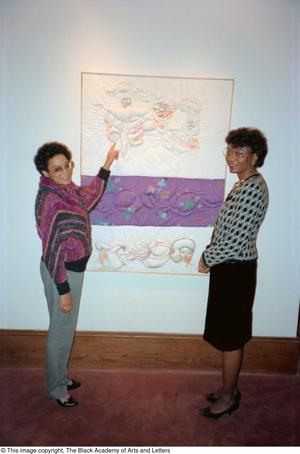 Primary view of object titled '[Photograph of two women looking at artwork]'.