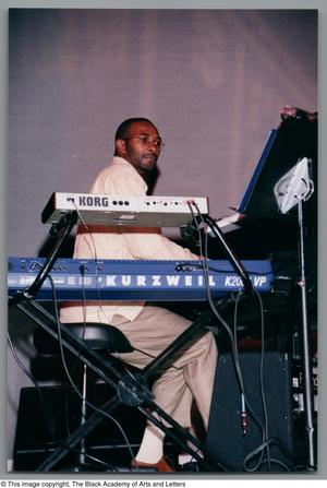Primary view of object titled '[Eric Willis playing the keys]'.