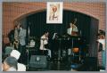 Primary view of [Photograph of a Claude Johnson, Marchel Ivery, and other band members performing on stage]