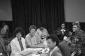 Photograph: [Individuals attending conference meeting at Sheraton Inn]