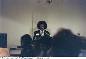 Primary view of object titled '[Curtis King speaking at podium]'.