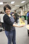 Photograph: [Workshop participant holding up book]