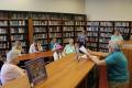 Photograph: [Attendees gathered in Temple Israel library]