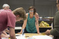Primary view of [Courtney Jacobs and participants at printing station]