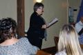 Photograph: [Woman addresses TXSSAR members and guests during meeting]