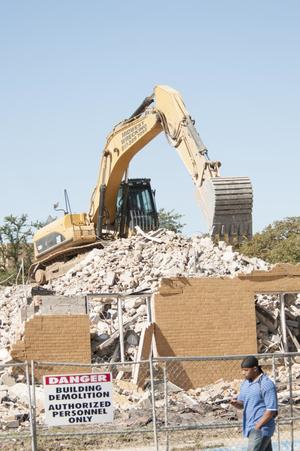 Primary view of object titled '[Excavator at Kendall Hall site]'.