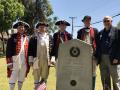 Photograph: [TXSSAR Arlington Chapter members standing next to grave marker]