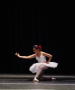 Photograph: [Ballet dancer kneels during a performance at the 2003 World Dance Al…