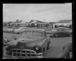 Photograph: [Cars parked on a street]