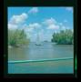 Photograph: [Photograph of a blue sailboat on the water]