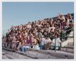 Photograph: [Photograph of TAMS students posing on the UNT stadium bleachers]