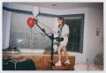 Thumbnail image of item number 1 in: '[Photograph of a TAMS student on an exercise machine]'.