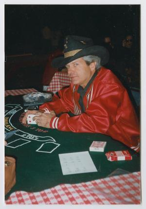 Primary view of object titled '[Photograph of a man at a poker table]'.