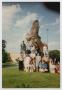 Photograph: [Photograph of TAMS students posing with UNT eagle statue]