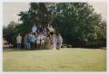 Photograph: [Photograph of TAMS students front of eagle statue]