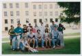 Photograph: [Photograph of TAMS students on a memorial bench]