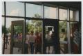 Photograph: [Photograph of TAMS students entering building]