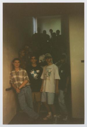 Primary view of object titled '[Photograph of TAMS students in hallway]'.